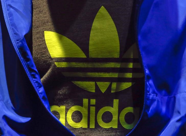 © Reuters. The Adidas logo is pictured on a shirt during the company's annual news conference in Herzogenaurach