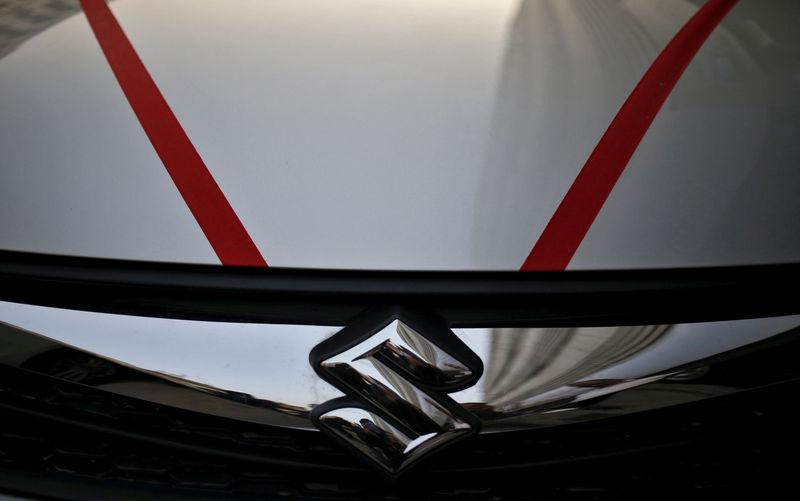 © Reuters. The logo of  Maruti Suzuki India Limited is seen on car parked outside a showroom in New Delhi