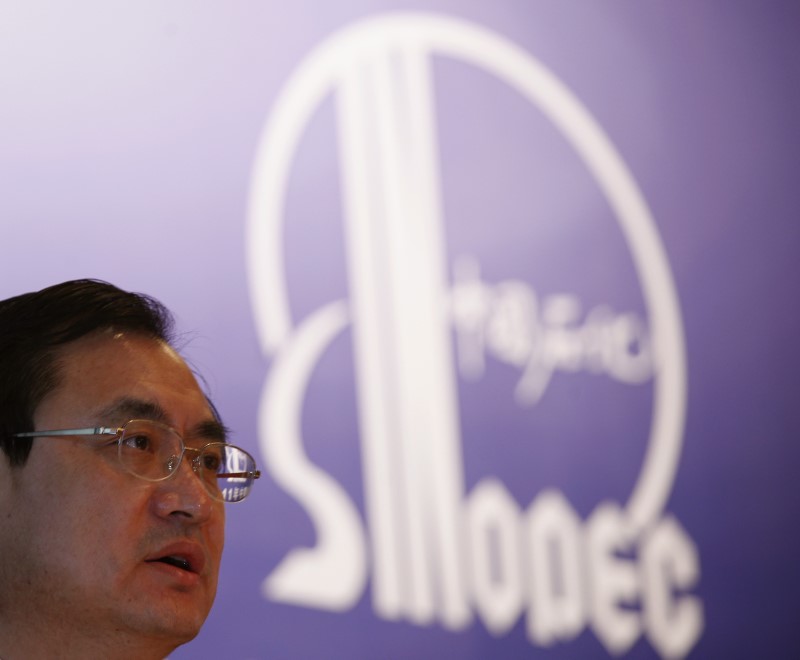 © Reuters. Sinopec Vice Chairman and President Wang speaks during a news conference in Hong Kong