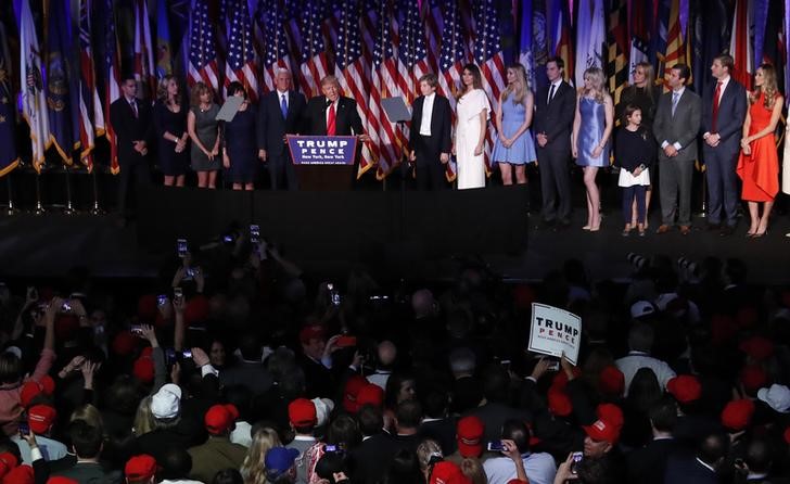 © Reuters. U.S. President-elect Trump is flanked by members of his family as well as relatives of Vice President-elect Pence while speaking at his election night rally in New York