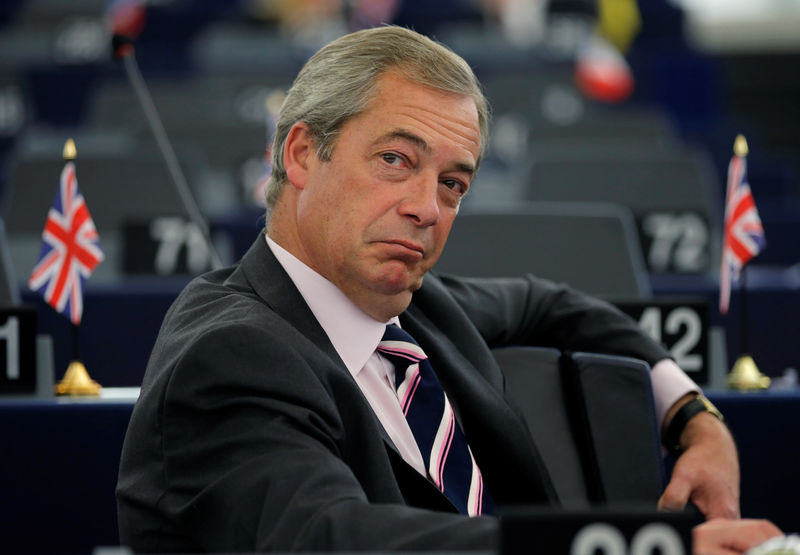 © Reuters. Farage, UKIP member and MEP waits for the start of a debate at the European Parliament in Strasbourg