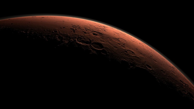 © Reuters. This computer-generated view depicts part of Mars at the boundary between darkness and daylight, with an area including Gale Crater beginning to catch morning light