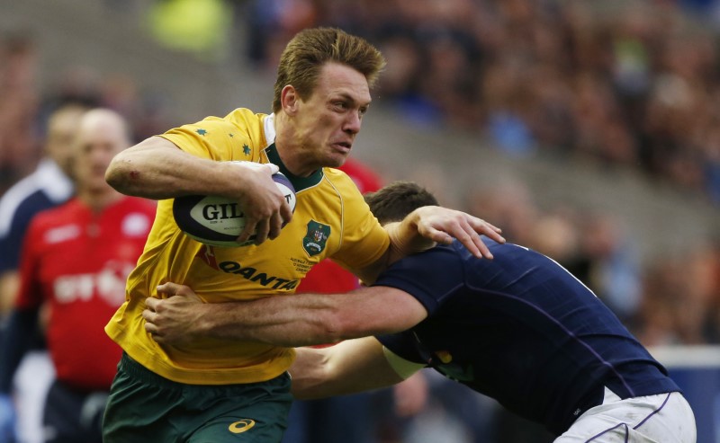 © Reuters. Australia’s Dane Haylett-Petty tackled by Scotland’s Alex Dunbar