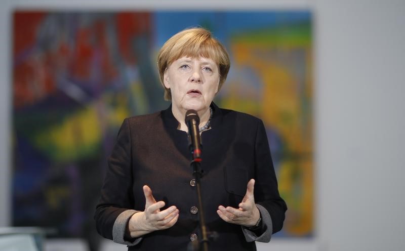 © Reuters. German Chancellor Merkel gives a statement on the nomination of Steinmeier as candidate for German President in Berlin