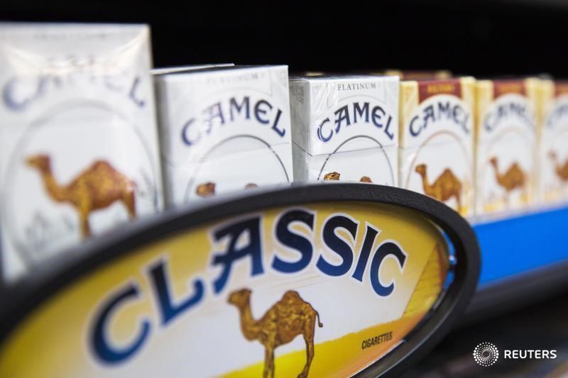 © Reuters. Camel cigarettes are stacked on a shelf inside a tobacco store in New York