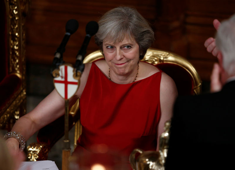 © Reuters. Britain's Prime Minister Theresa May reacts to applause after making her speech at the Lord Mayor's Banquet, at the Guildhall, London