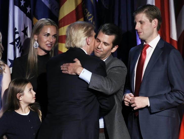 © Reuters. Republican U.S. presidential nominee Donald Trump is accompanied by members of his family as he arrives to address supporters at his election night rally in New York