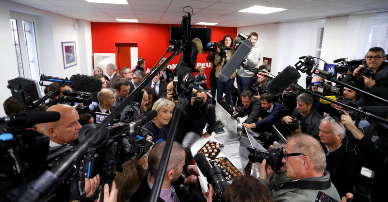 © Reuters. France's far-right National Front (FN) leader Marine Le Pen talks to journalists as she inaugurates her party campaign headquarters "L'Escale" for the 2017 French presidential election in Paris