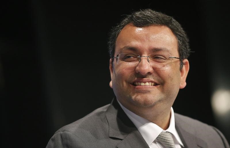 © Reuters. Mistry, chairman of Tata Group, smiles during the TCS annual general meeting in Mumbai