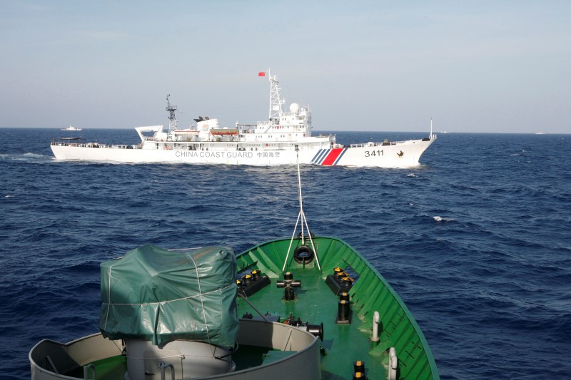 © Reuters. A ship of Chinese Coast Guard is seen near a ship of Vietnam Marine Guard in the South China Sea