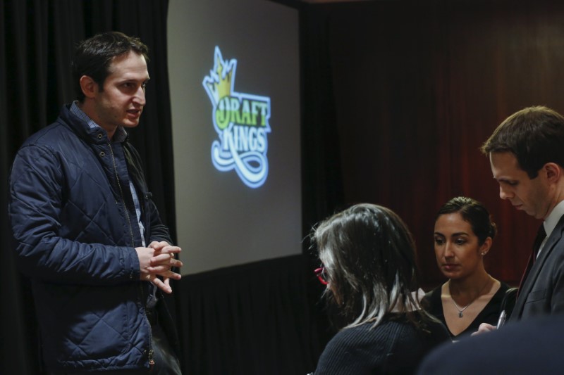 © Reuters. DraftKings CEO Jason Robins speaks to reporters after speaking during the DFS Players Conference in New York