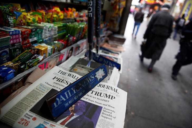 © Reuters. The cover of the Wall Street Journal newspaper is seen with other papers at a news stand in New York