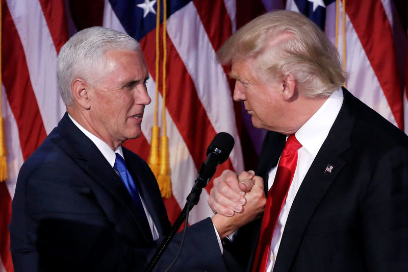 © Reuters. U.S. President-elect Donald Trump and Vice President-elect Mike Pence embrace at their election night rally in Manhattan, New York