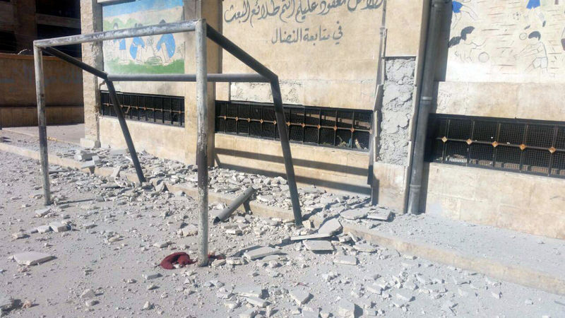 © Reuters. A view shows a damaged school playground after shelling by Syrian rebels on government-held western Aleppo