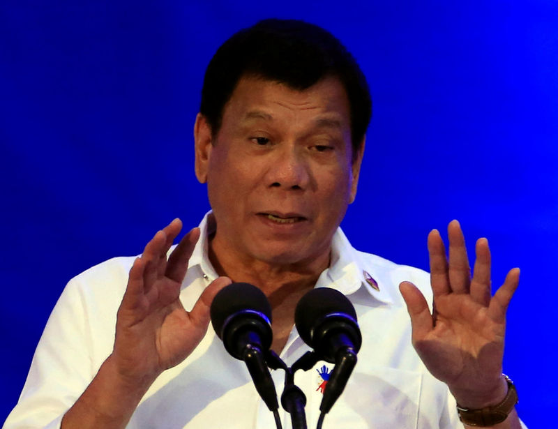 © Reuters. Philippine President Rodrigo Duterte gestures while delivering a speech during the 80th National Bureau of Investigation (NBI) founding anniversary at the NBI headquarters in metro Manila