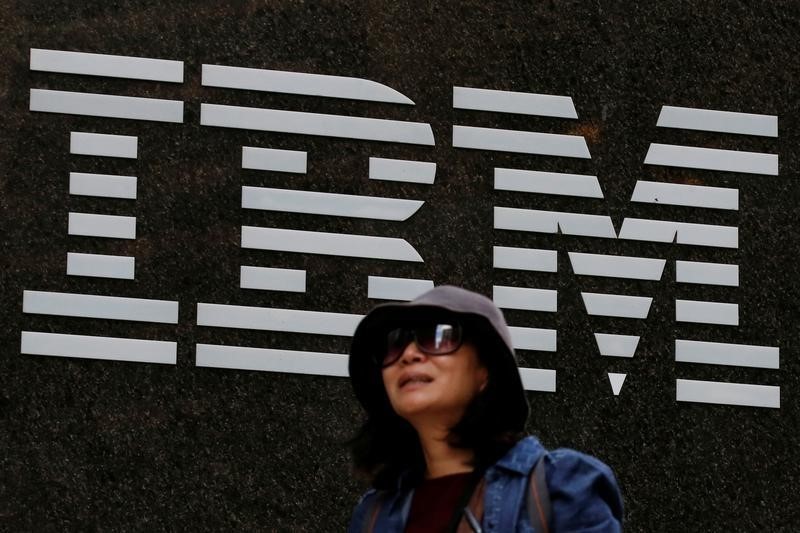 © Reuters. A woman passes by the IBM offices in New York