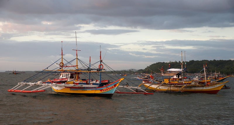© Reuters. Fishing boats that had just returned from the disputed Scarborough Shoal are pictured at the coastal village of Cato in Infanta