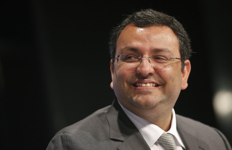 © Reuters. Mistry, chairman of Tata Group, smiles during the TCS annual general meeting in Mumbai