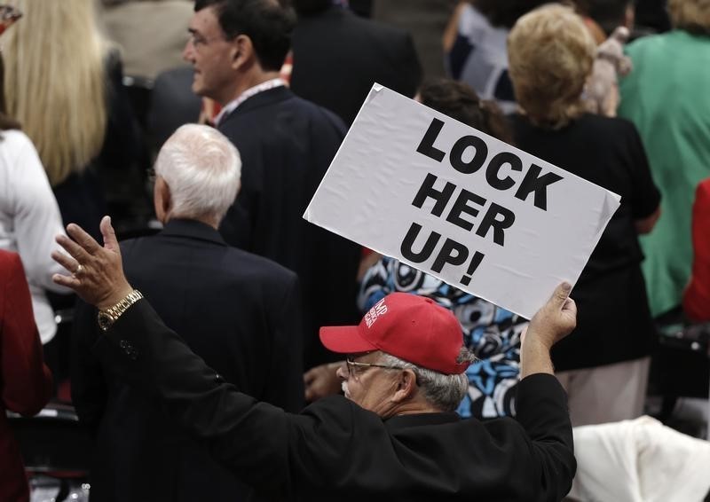 © Reuters. A delegate holds a sign during the third day of the Republican National Convention in Cleveland