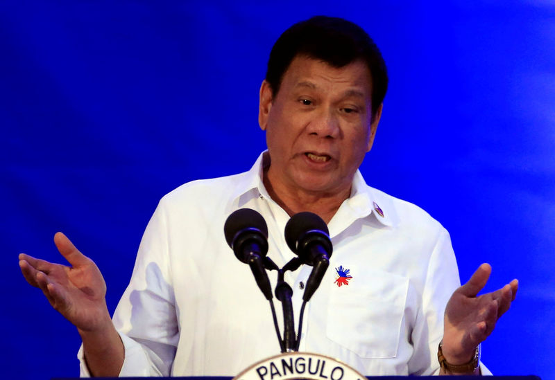 © Reuters. Philippine President Rodrigo Duterte gestures while delivering a speech during the 80th National Bureau of Investigation (NBI) founding anniversary at the NBI headquarters in metro Manila