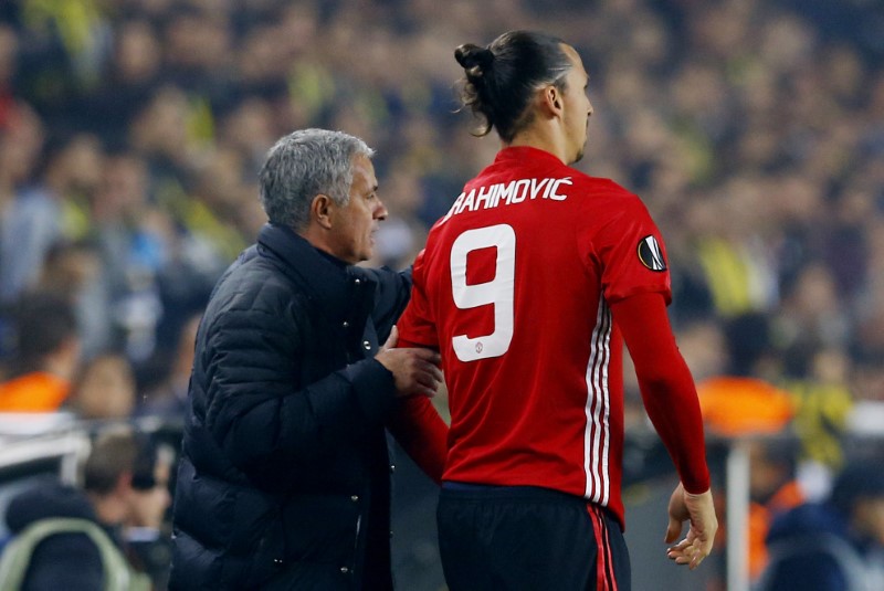 © Reuters. Manchester United manager Jose Mourinho with Zlatan Ibrahimovic as he prepares to come on