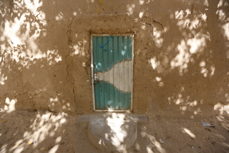 © Reuters. The entrance gate of the house belonging to suspected suicide bomber Qari Naib is pictured in Bagram