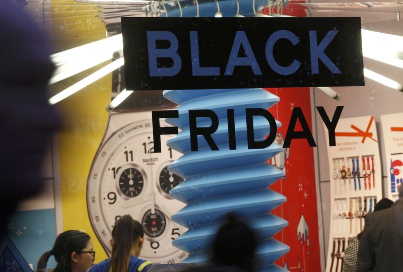 © Reuters. A sign promoting "Black Friday" is seen in the window of a store in Oxford Street, London