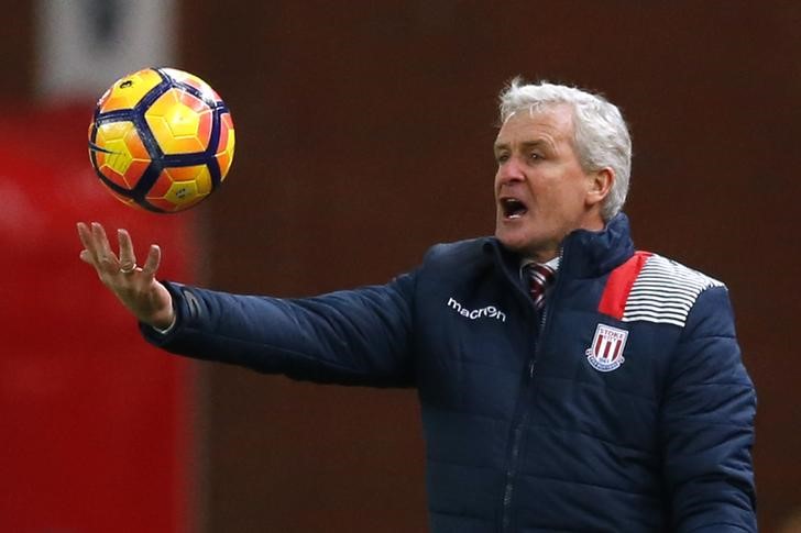 © Reuters. Stoke City manager Mark Hughes with the match ball