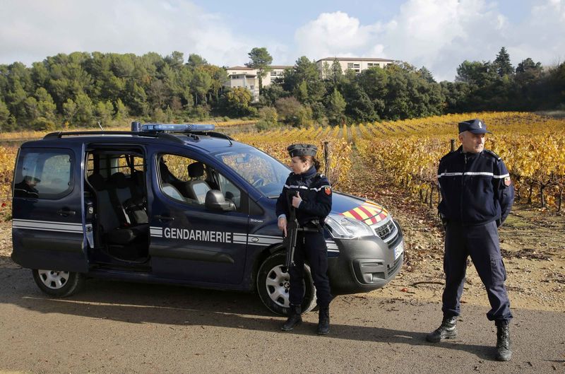 © Reuters. French gendarmes stand guard near a retirement home in Montferrier-sur-Lez, near Montpellier
