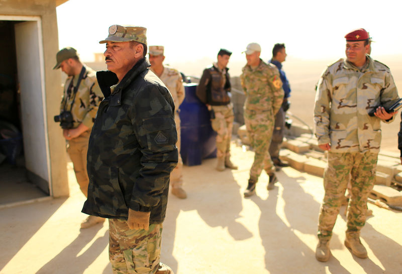 © Reuters. Nineveh Operations Commander Major General Najm al-Jubbouri leads his troops during an operation against Islamic State militants southeast of Mosul