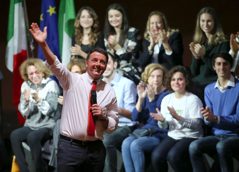 © Reuters. Italian Prime Minister Matteo Renzi waves as he talks during a meeting in support of the 'Yes' vote in the upcoming constitutional reform referendum in Rome