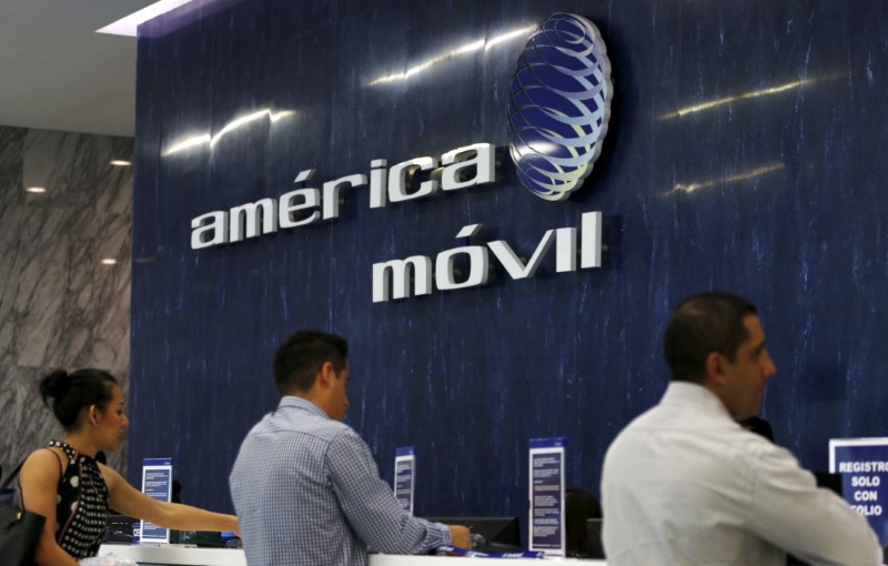 © Reuters. The America Movil logo is seen at the reception area in the company's offices in Mexico City
