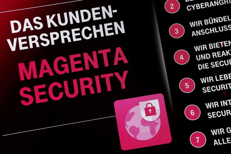© Reuters. A screen displays "The promise for clients - Magenta Security" at a Deutsche Telekom "Security in Magenta" congress in Frankfurt