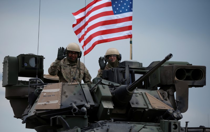 © Reuters. U.S. servicemen drive their armoured vehicle during an opening ceremony of U.S. led joint military exercise "Noble Partner 2016" in Vaziani