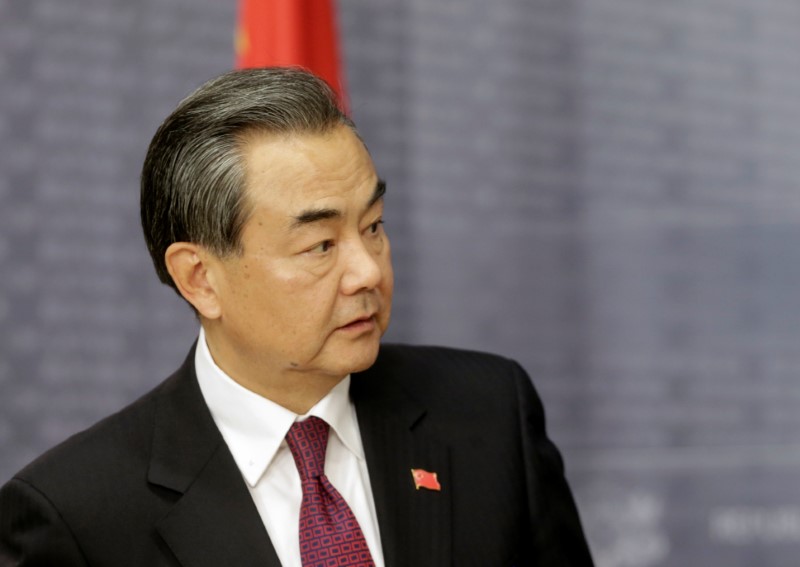 © Reuters. China's Foreign Minister Wang Yi looks on in Riga