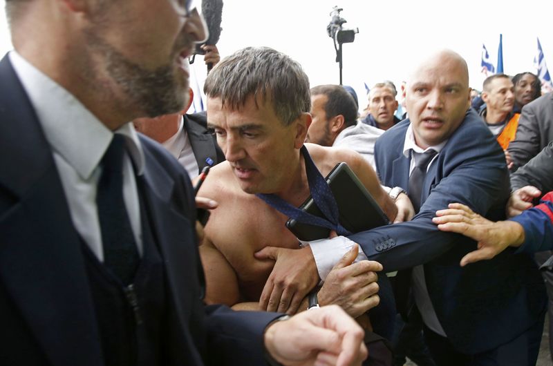 © Reuters. File photo shows Xavier Broseta, Executive Vice President for Human Resources and Labour Relations at Air France, who was evacuated by security after employees interrupted a meeting at the Air France headquarters building in Roissy