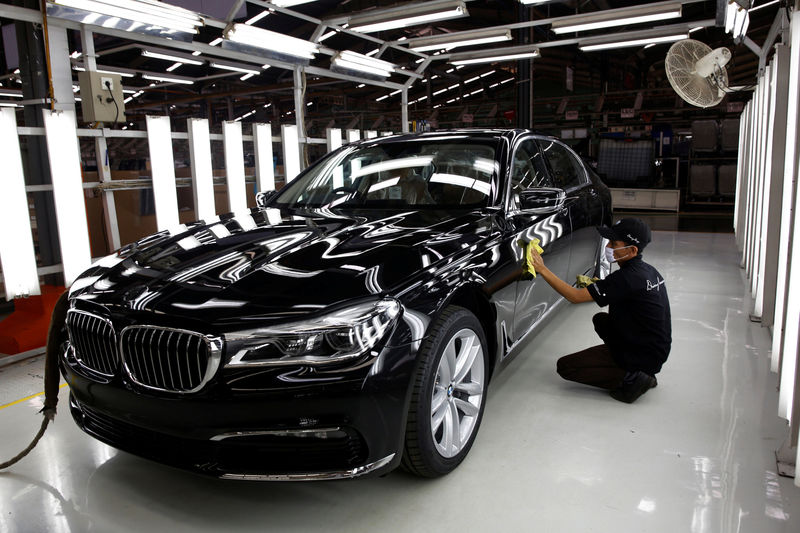 © Reuters. A worker checks the paint on a locally assembled new BMW 7 Series at a Gaya Motor assembly plant in Jakarta