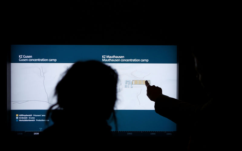 © Reuters. Visitors are seen in the museum of the former concentration camp in Mauthausen