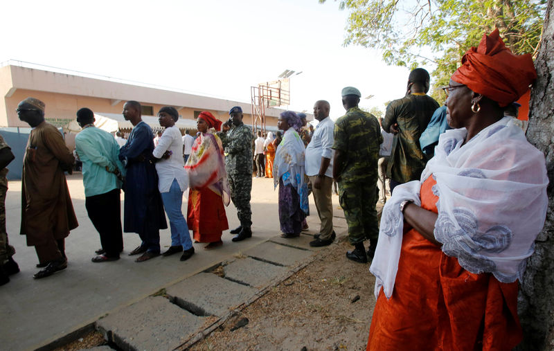 © Reuters. People queue to vote during the presidential election in Banjul