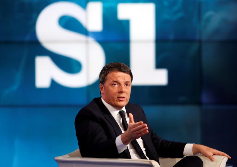 © Reuters. Italy's PM Renzi gestures as he attends television talk show "Porta a Porta" (Door to Door) in Rome