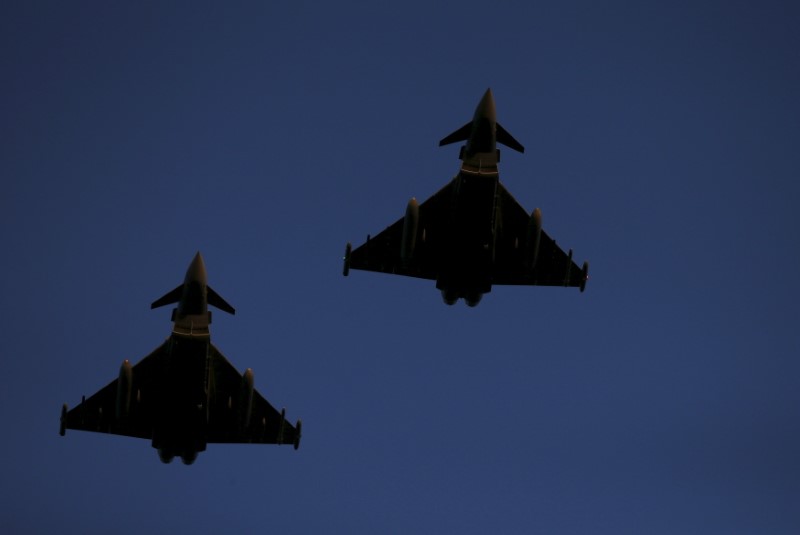 © Reuters. RAF Typhoons fly above RAF Lossiemouth in Scotland