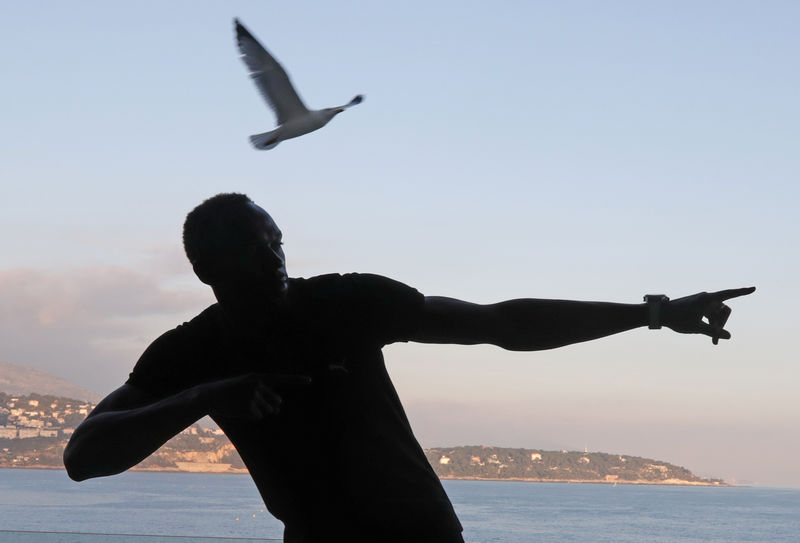 © Reuters. Usain Bolt of Jamaica poses before a press conference for the 2016 IAAF Athletics Awards in Monaco