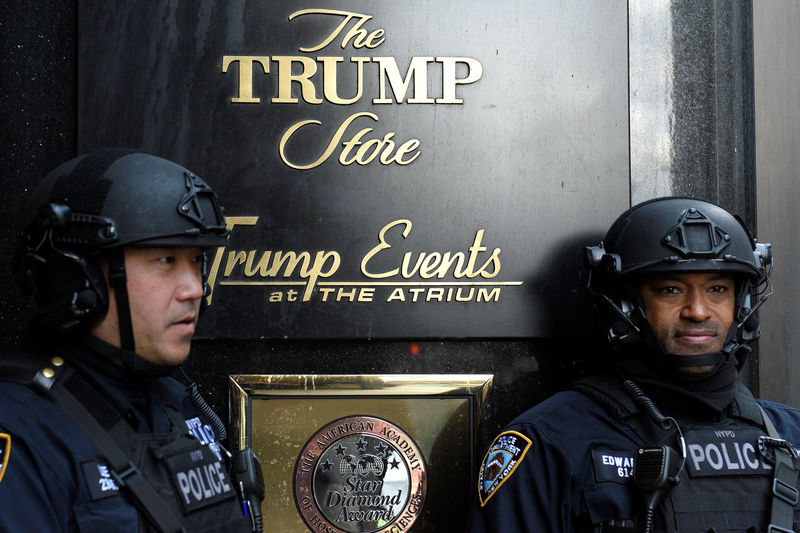 © Reuters. Heavily armed New York City Police (NYPD) officers stand guard in front of Trump Tower where Republican president-elect Donald Trump lives in the Manhattan borough of New York