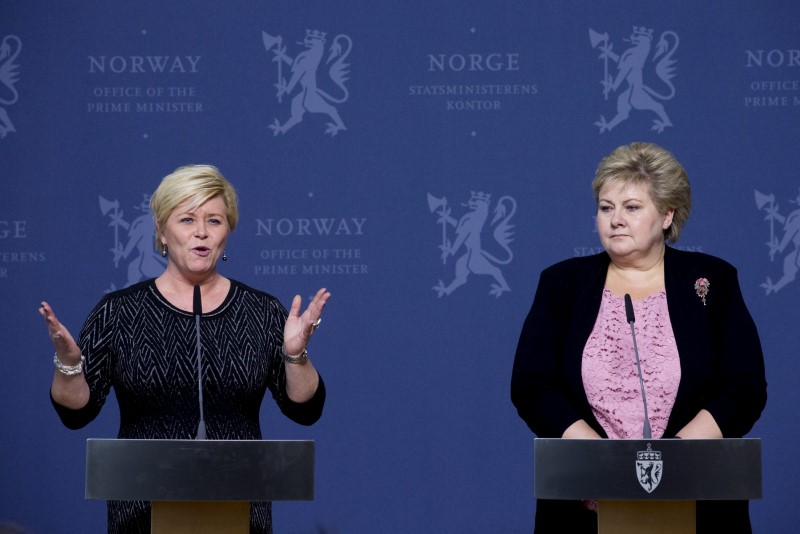© Reuters. Norway's Finance Minister Siv Jensen speaks to the media next to Prime Minister Erna Solberg in Oslo