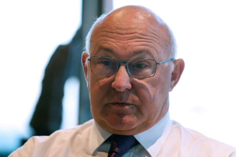 © Reuters. French Finance Minister Michel Sapin speaks during an interview with Reuters in his office at the Bercy Ministry in Paris