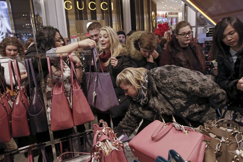 © Reuters. Women shop for handbags at Macy's Herald Square store during the early opening of the Black Friday sales in the Manhattan borough of New York