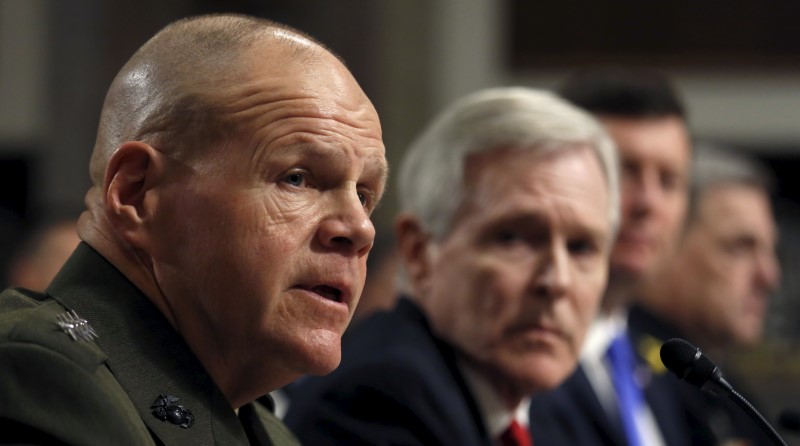 © Reuters. Neller testifies at the Senate hearing about women deployed in ground combat units on Capitol Hill  in Washington