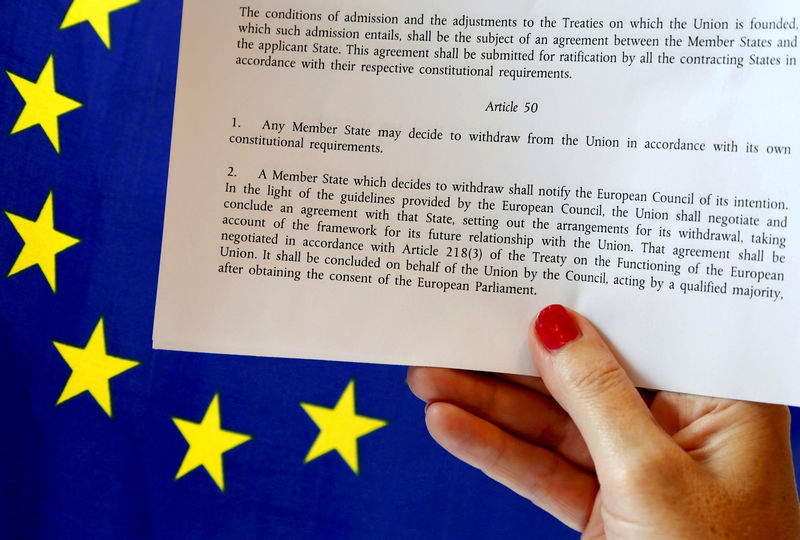© Reuters. Article 50 of the EU's Lisbon Treaty is pictured near an EU flag following Britain's referendum results to leave the European Union, in this photo illustration taken in Brussels