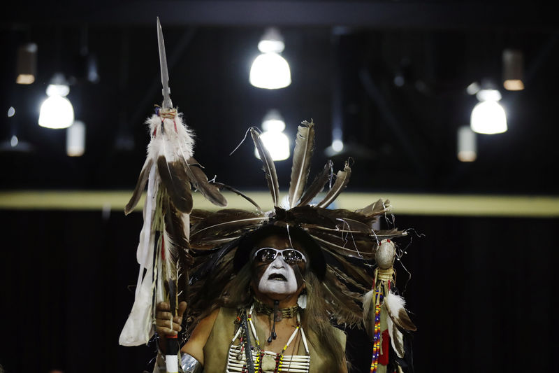 © Reuters. A Native American dancer takes part in a "victory pow wow" to celebrate with activists and veterans who had spent time in the Oceti Sakowin camp at the Prairie Knights Casino in the Standing Rock Indian Reservation, near Fort Yates, North Dakota
