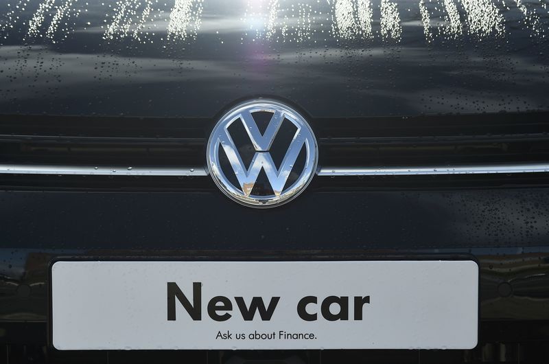 © Reuters. Signage for a new Volkswagen car is seen at a dealership in London